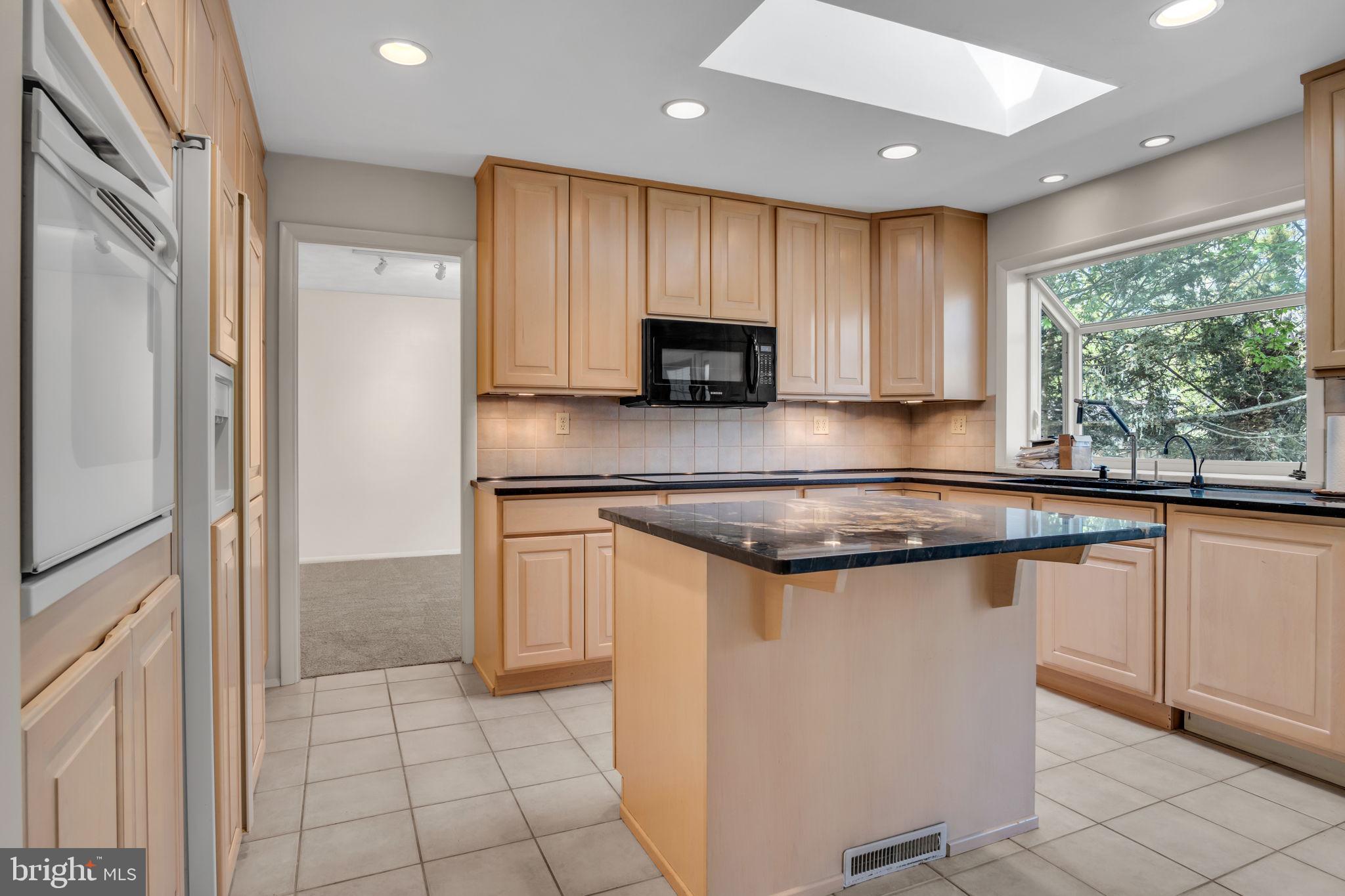 4536 Custer Drive Harrisburg, PA 17110 - Photo 16 of 53 a kitchen with stainless steel appliances granite countertop a stove a sink and a refrigerator