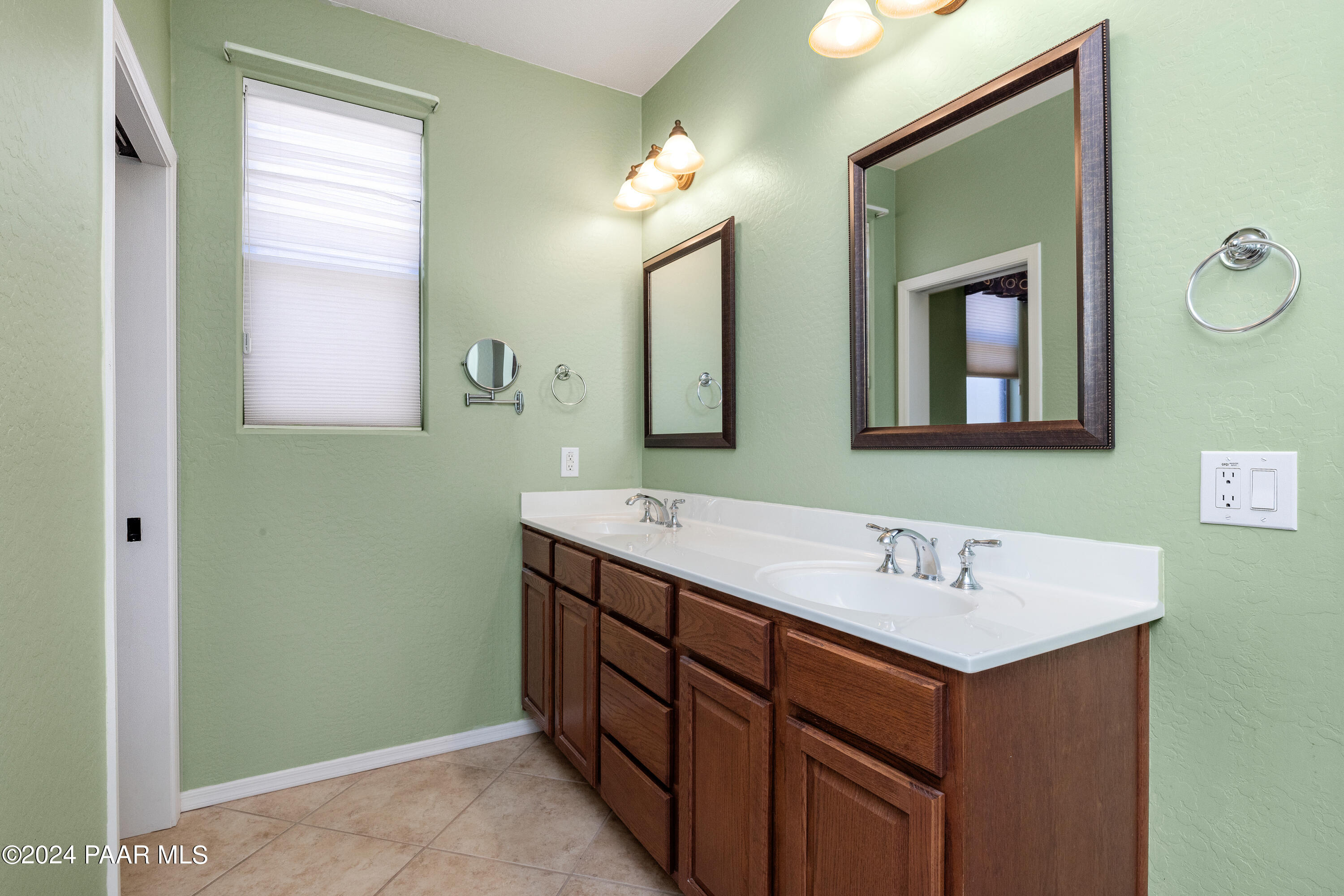 1195 Rigo Ranch Road Prescott Valley, AZ 86314 - Photo 11 of 65 a bathroom with a sink and a mirror