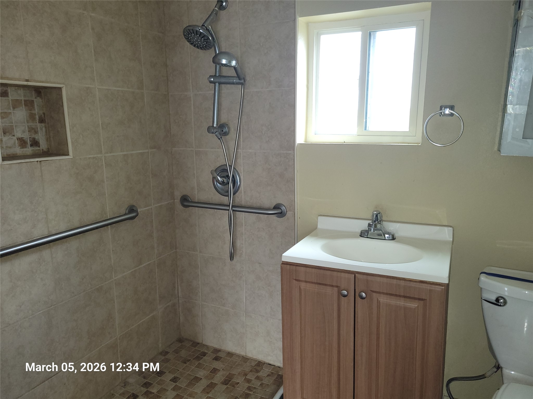 2000 Alamo Street Austin, TX 78722 - Photo 6 of 8 a bathroom with a sink toilet and vanity