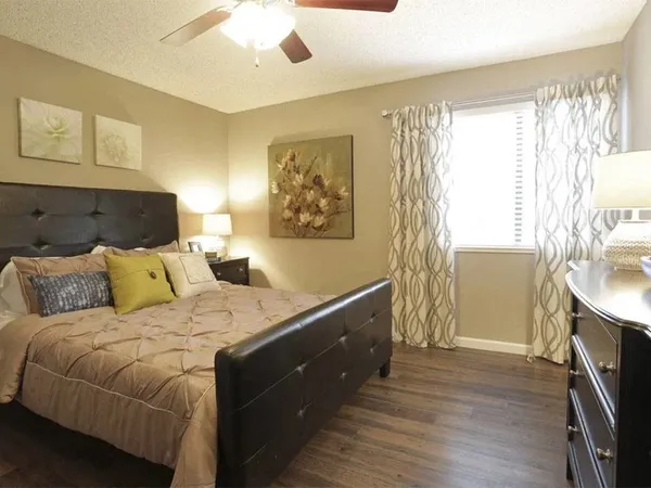 a bed room with a bed and a window