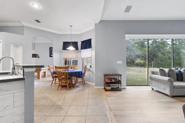 a view of a dining room with furniture window and outside view