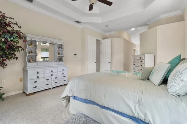 a kitchen with granite countertop white cabinets and stainless steel appliances