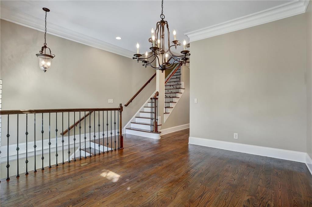 2443 Gatebury Circle Atlanta, GA 30341 - Photo 13 of 45 a view of a hallway with wooden floor and stairs