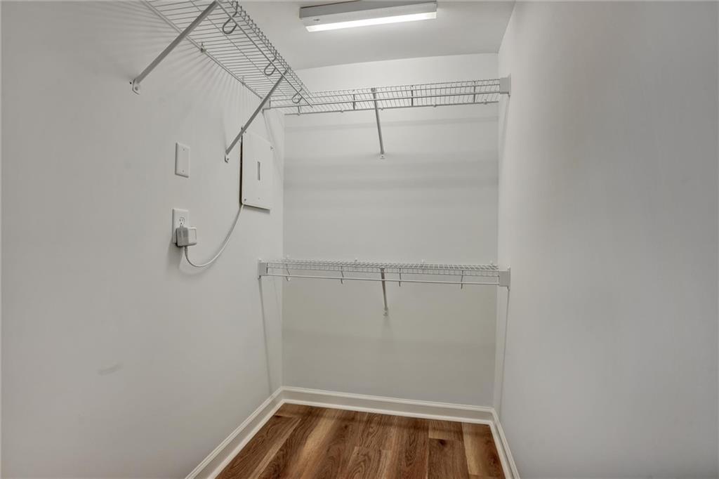 2443 Gatebury Circle Atlanta, GA 30341 - Photo 21 of 45 a view of walk in closet with racks on the wall