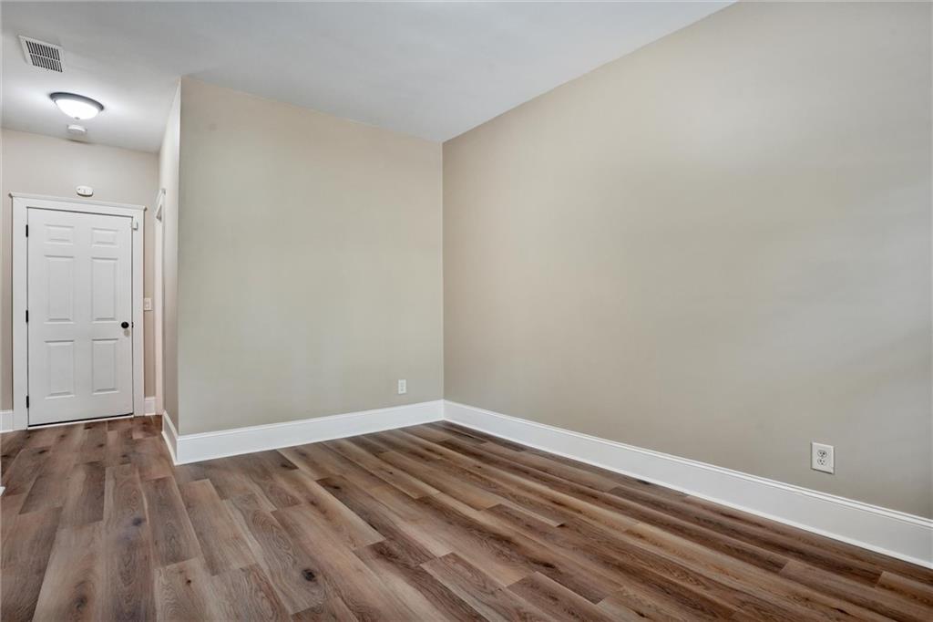 2443 Gatebury Circle Atlanta, GA 30341 - Photo 23 of 45 a view of room with wooden floor