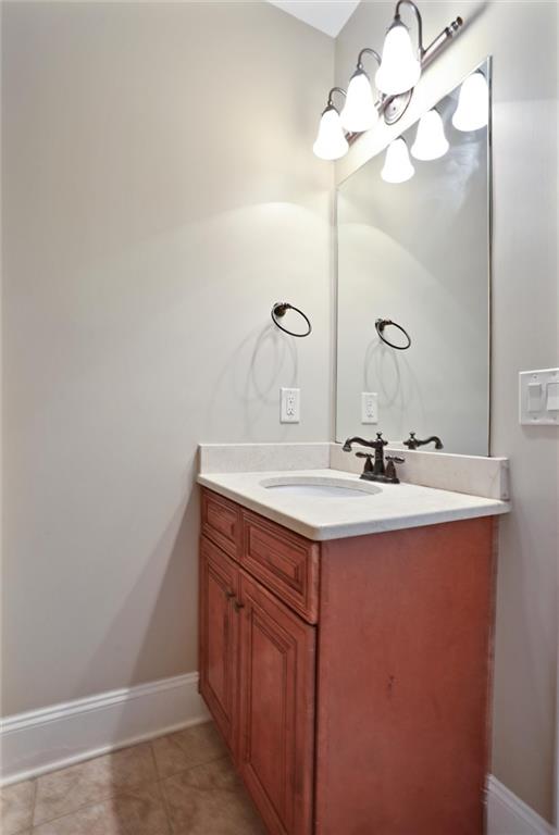 2443 Gatebury Circle Atlanta, GA 30341 - Photo 25 of 45 a bathroom with a sink a light fixture and a mirror