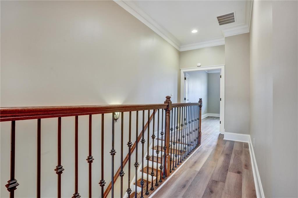 2443 Gatebury Circle Atlanta, GA 30341 - Photo 29 of 45 a view of a hallway with wooden floor