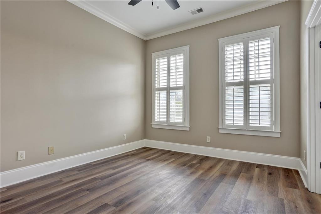 2443 Gatebury Circle Atlanta, GA 30341 - Photo 31 of 45 a view of an empty room with wooden floor and a window