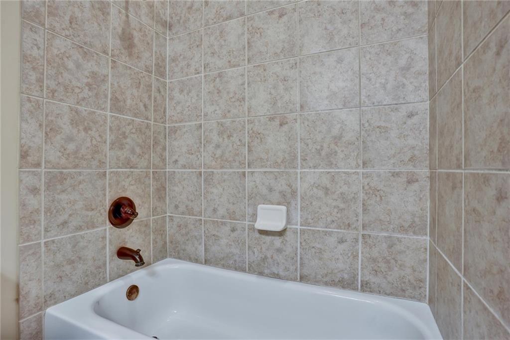 2443 Gatebury Circle Atlanta, GA 30341 - Photo 35 of 45 a bathroom with a tub