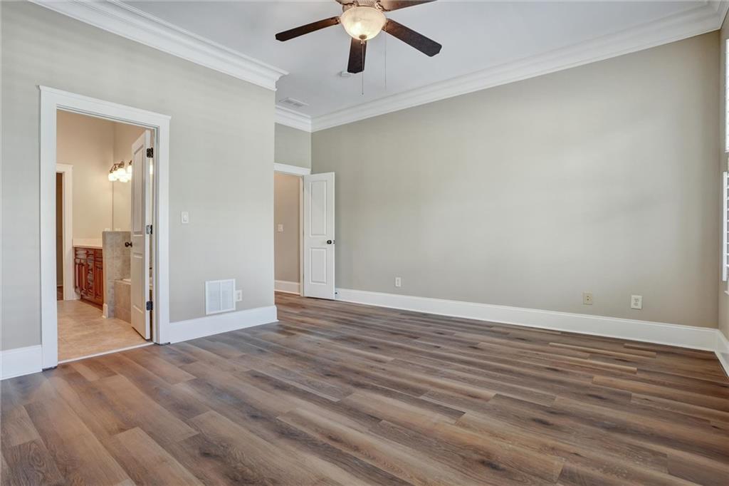 2443 Gatebury Circle Atlanta, GA 30341 - Photo 38 of 45 a view of an empty room with wooden floor