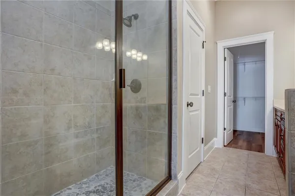 a bathroom with a glass shower door
