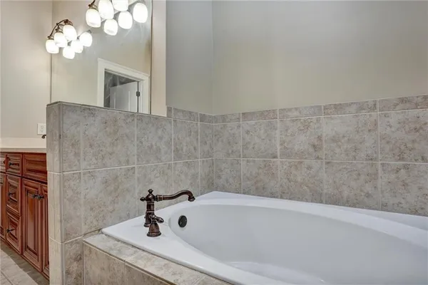 a bathroom with a sink a toilet and bathtub