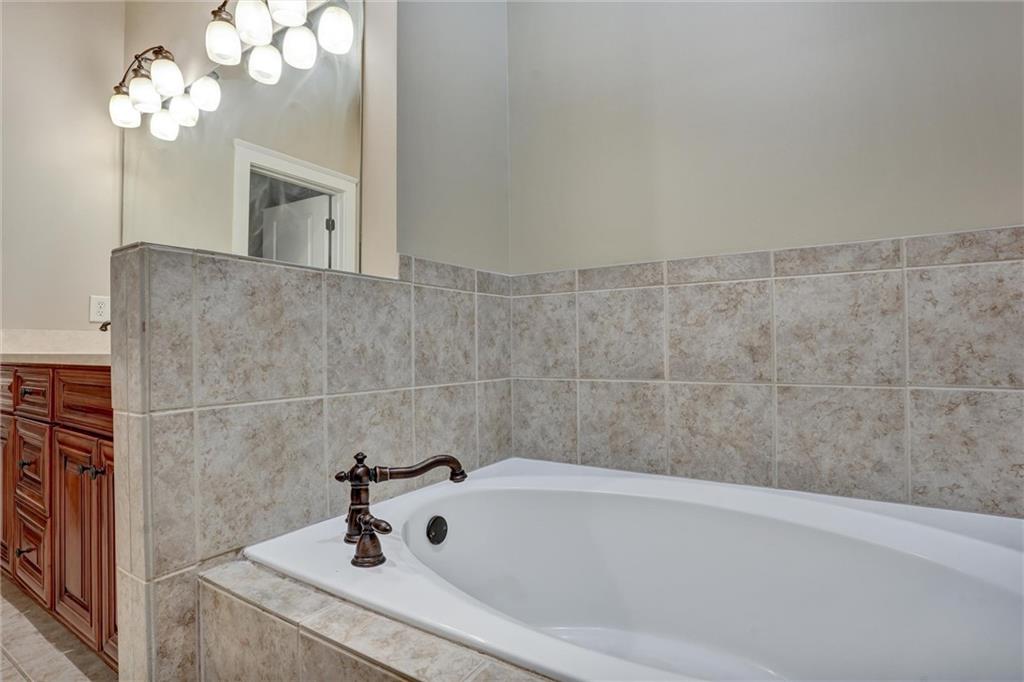 2443 Gatebury Circle Atlanta, GA 30341 - Photo 40 of 45 a bathroom with a sink a toilet and bathtub