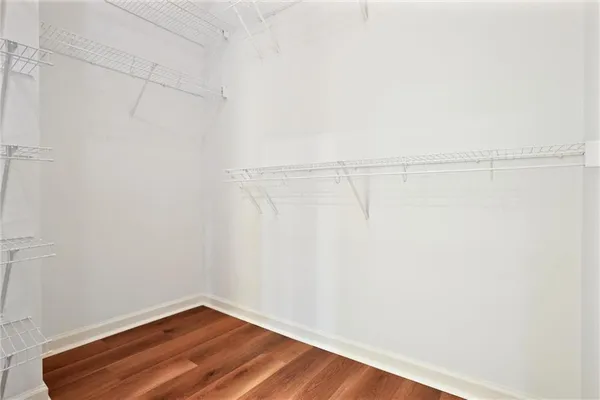 a view of a room with wooden floor