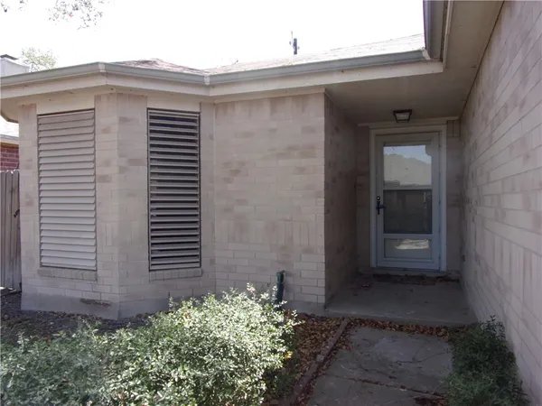 a view of a back yard of a house