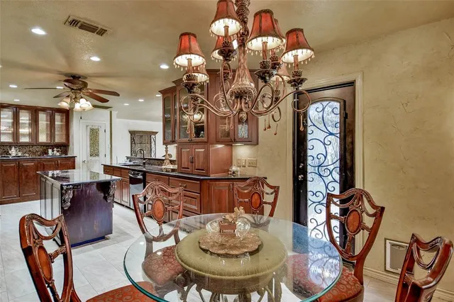 a kitchen with granite countertop a sink and a window