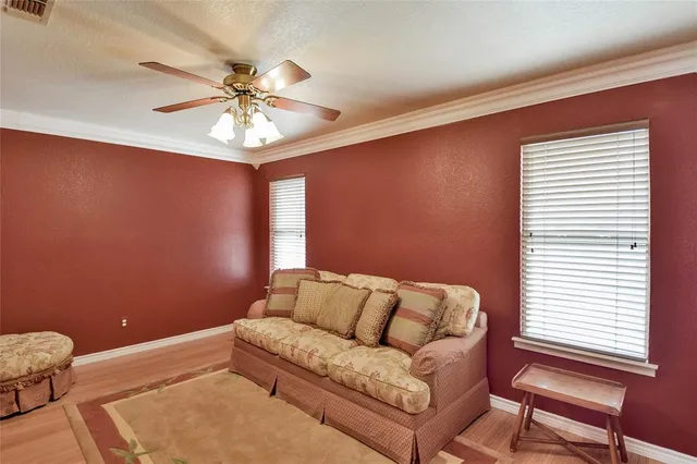 a bedroom with two beds and a chandelier