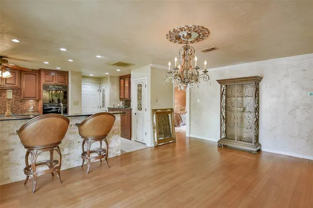 a kitchen with counter top space cabinets and stainless steel appliances