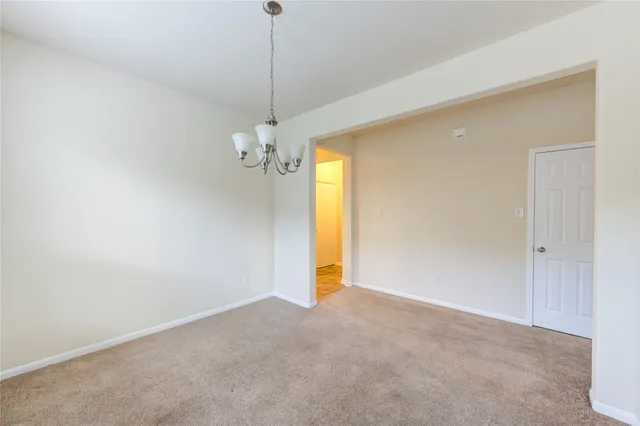 a view of empty room with windows