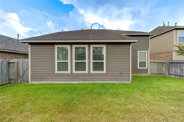 a backyard of a house with lots of green space
