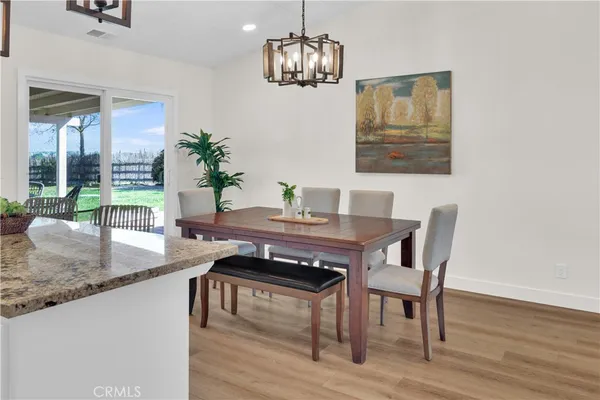 a kitchen with granite countertop cabinets and stainless steel appliances