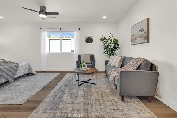 a bedroom with a bed and a night stand