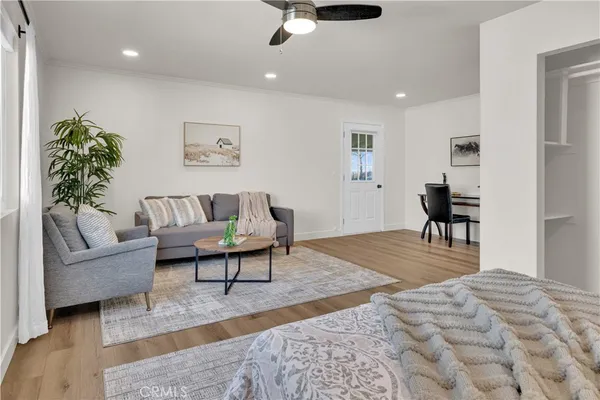 a view of a livingroom with furniture and wooden floor