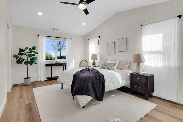 a bedroom with a bed and a view of bathroom