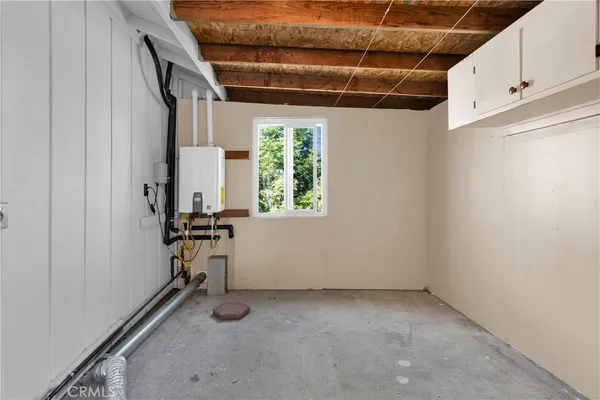 a house that has a tree in front of it