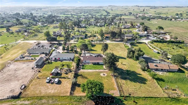 an aerial view of a residential apartment building with a yard