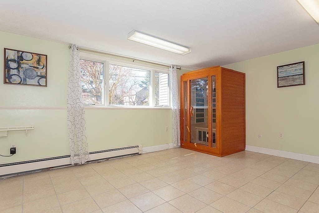 130 Worthen Road Lexington, MA 02421 - Photo 20 of 27 an empty room with windows
