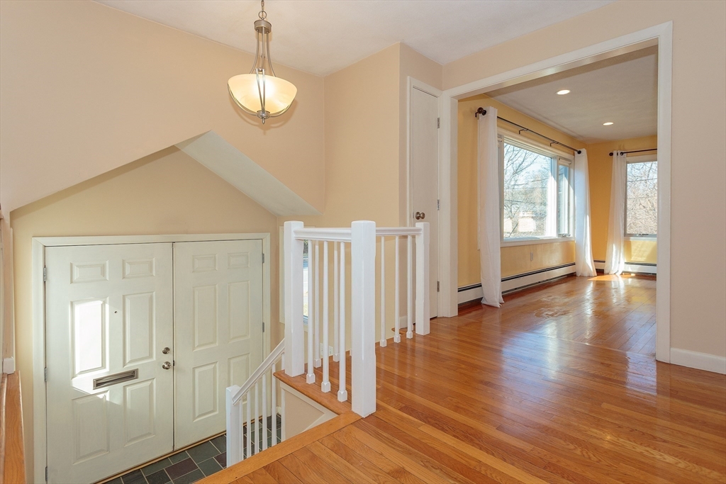 130 Worthen Road Lexington, MA 02421 - Photo 3 of 27 a view of a hallway with wooden floor
