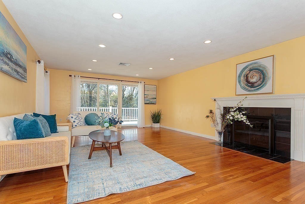 130 Worthen Road Lexington, MA 02421 - Photo 4 of 27 a living room with furniture and a fireplace