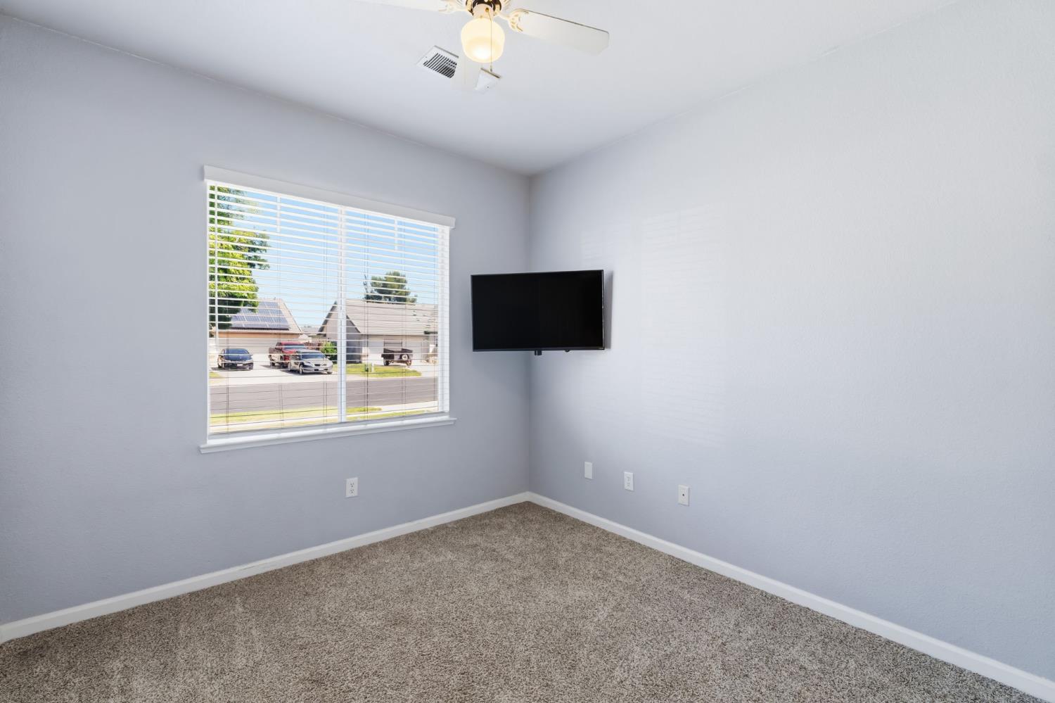1757 Homestead Way Lemoore, CA 93245 - Photo 20 of 35 an empty room with a window