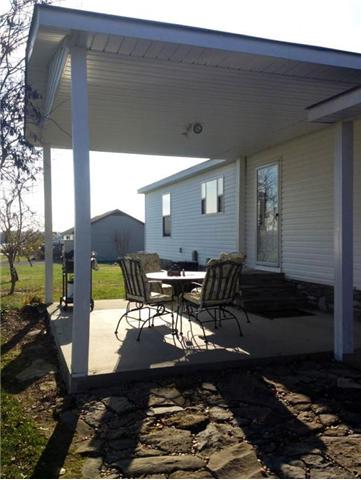 294 Williams Road Lafayette, TN 37083 - Photo 10 of 11 BEAUTIFUL COVERED PATIO NEXT TO YOUR TRANQUIL POND AND FLOWER GARDENS