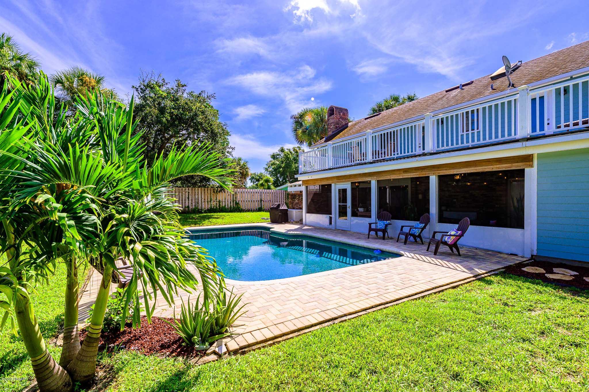 35 Neptune Avenue Ormond Beach, FL 32176 - Photo 14 of 58 a view of a house with swimming pool and sitting area