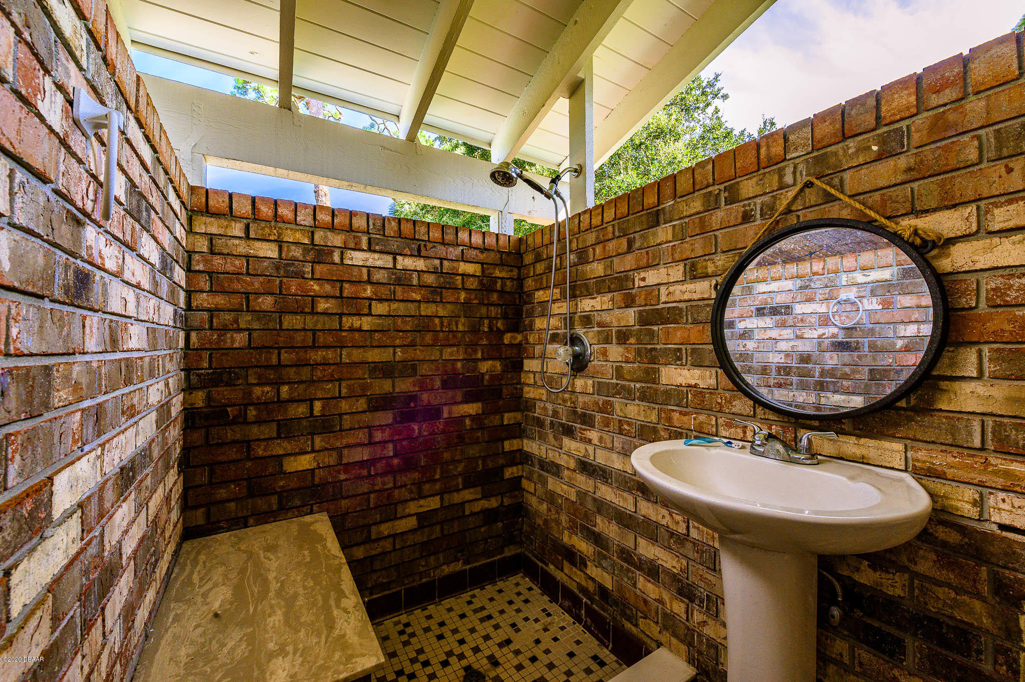 35 Neptune Avenue Ormond Beach, FL 32176 - Photo 18 of 58 a bathroom with a sink and a mirror