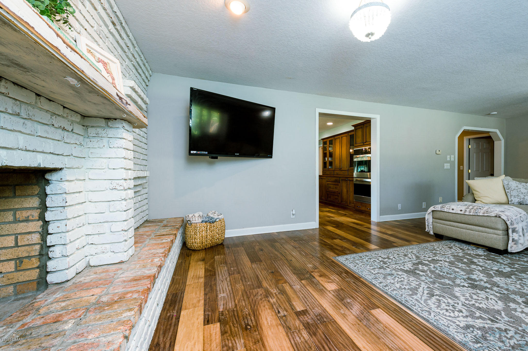 35 Neptune Avenue Ormond Beach, FL 32176 - Photo 25 of 58 a bedroom with a bed and a flat screen tv