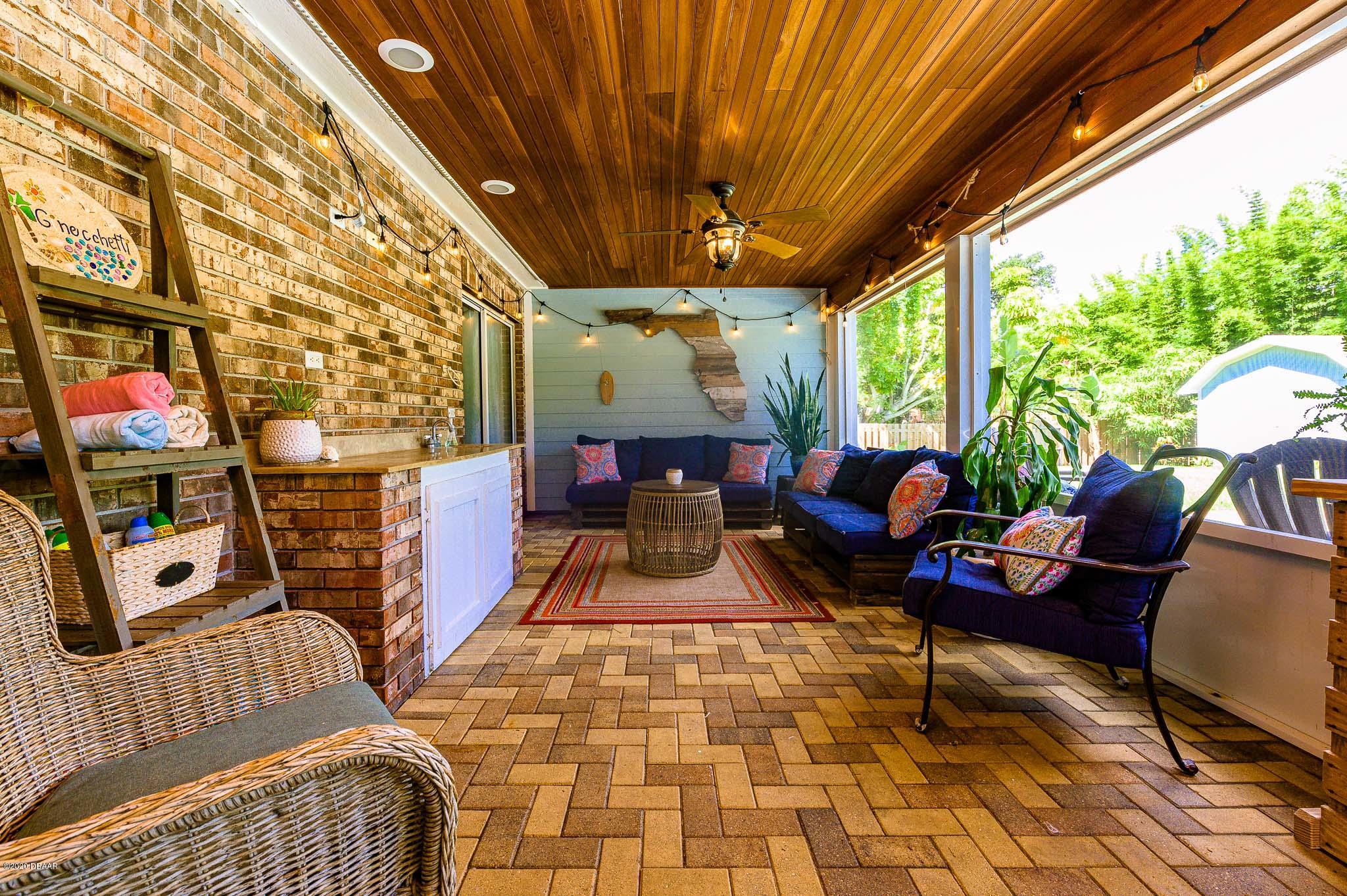 35 Neptune Avenue Ormond Beach, FL 32176 - Photo 37 of 58 a outdoor living space with furniture