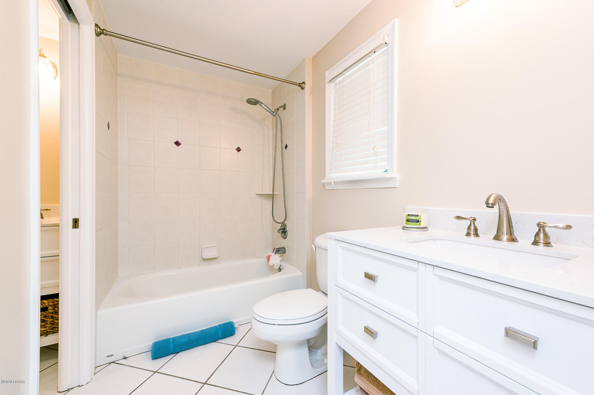 35 Neptune Avenue Ormond Beach, FL 32176 - Photo 47 of 58 a bathroom with a sink a toilet and a bathtub