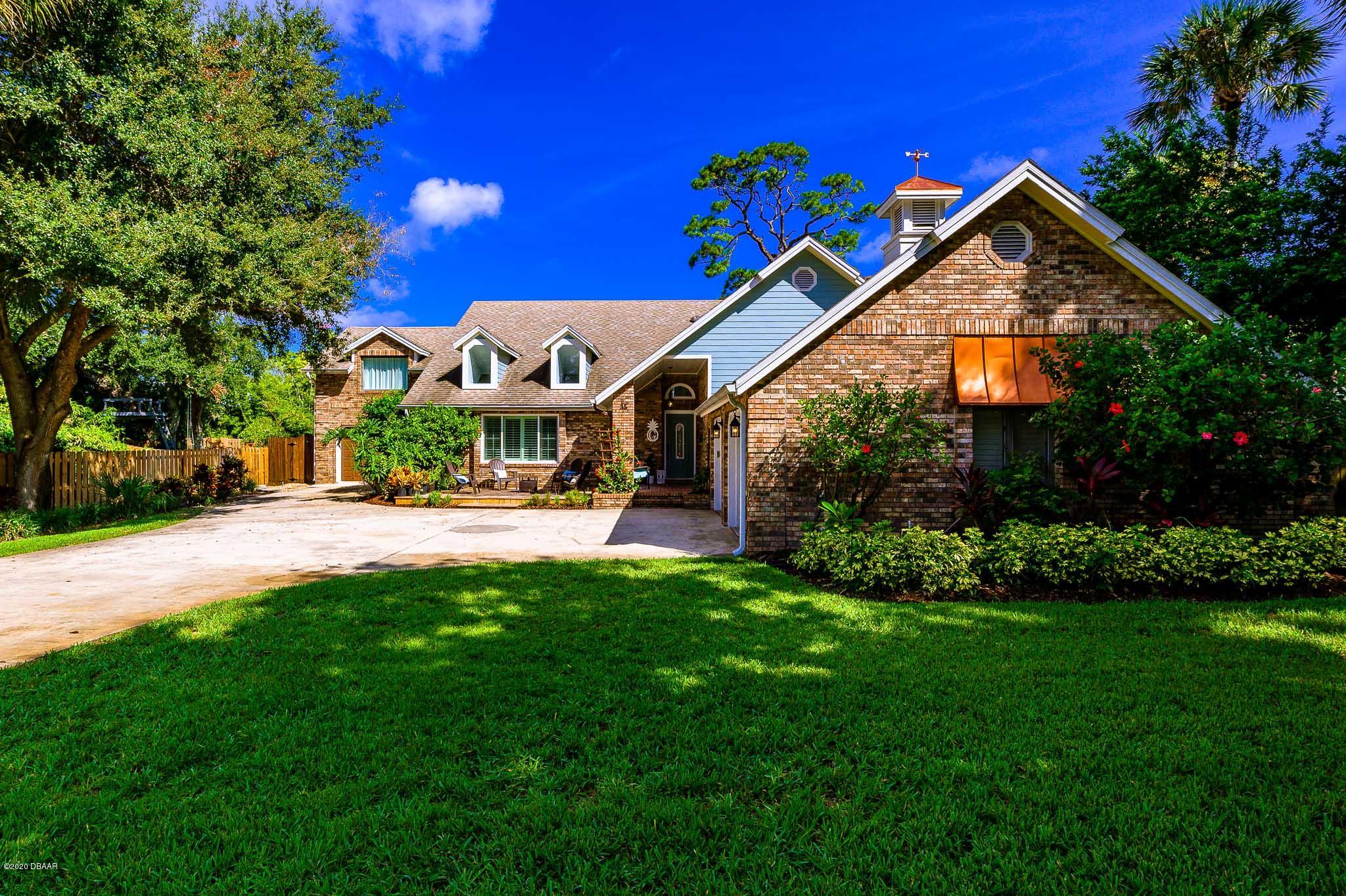 35 Neptune Avenue Ormond Beach, FL 32176 - Photo 6 of 58 a view of an house with backyard and garden