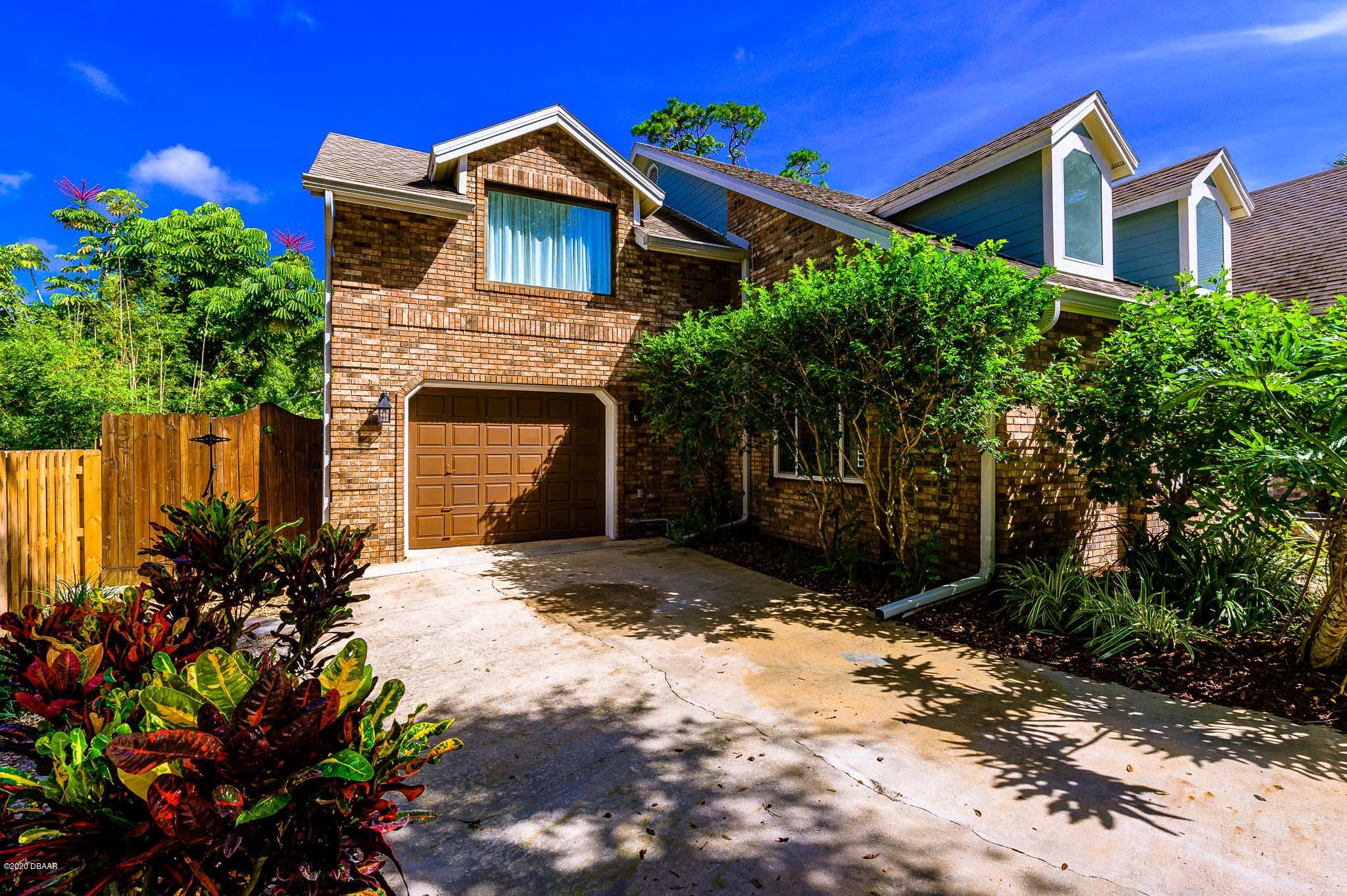 35 Neptune Avenue Ormond Beach, FL 32176 - Photo 7 of 58 a front view of a house with a yard