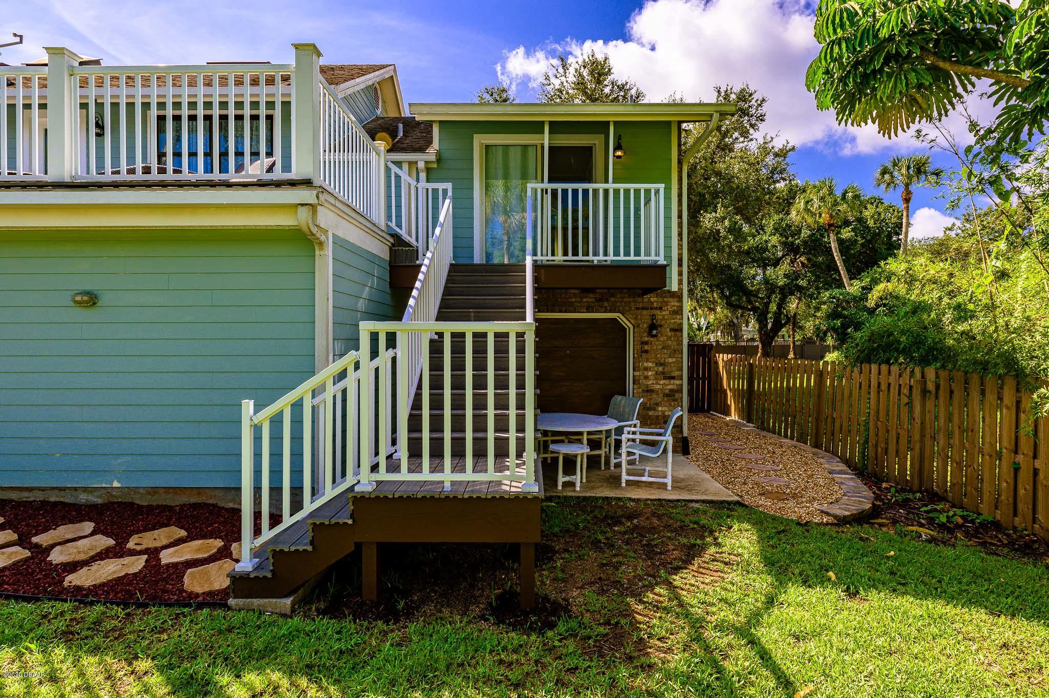 35 Neptune Avenue Ormond Beach, FL 32176 - Photo 9 of 58 a view of a chair and table in backyard