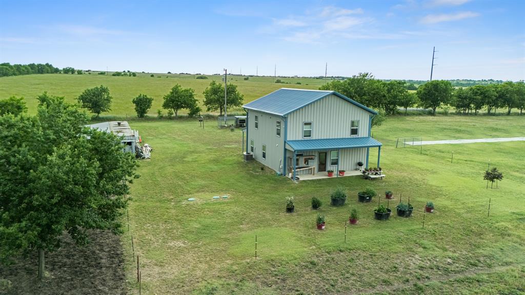124 County Road 4511 Decatur, TX 76234 - Photo 38 of 39 a view of a house with a yard and a fountain