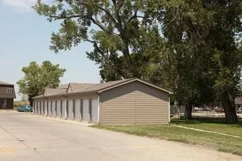a view of a house with a yard and garage