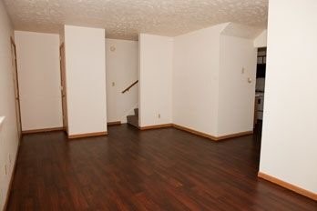 901 North 35th Street Other, IA 51501 - Photo 6 of 11 a view of an empty room with wooden floor