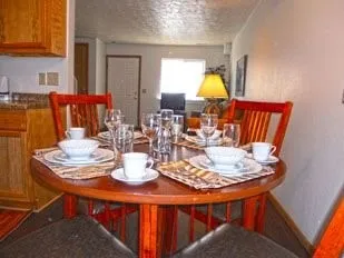 a dining room with furniture and lamp