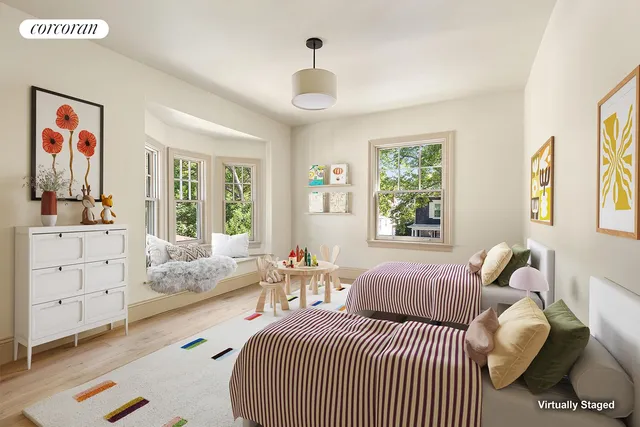 a bedroom with furniture and a large window