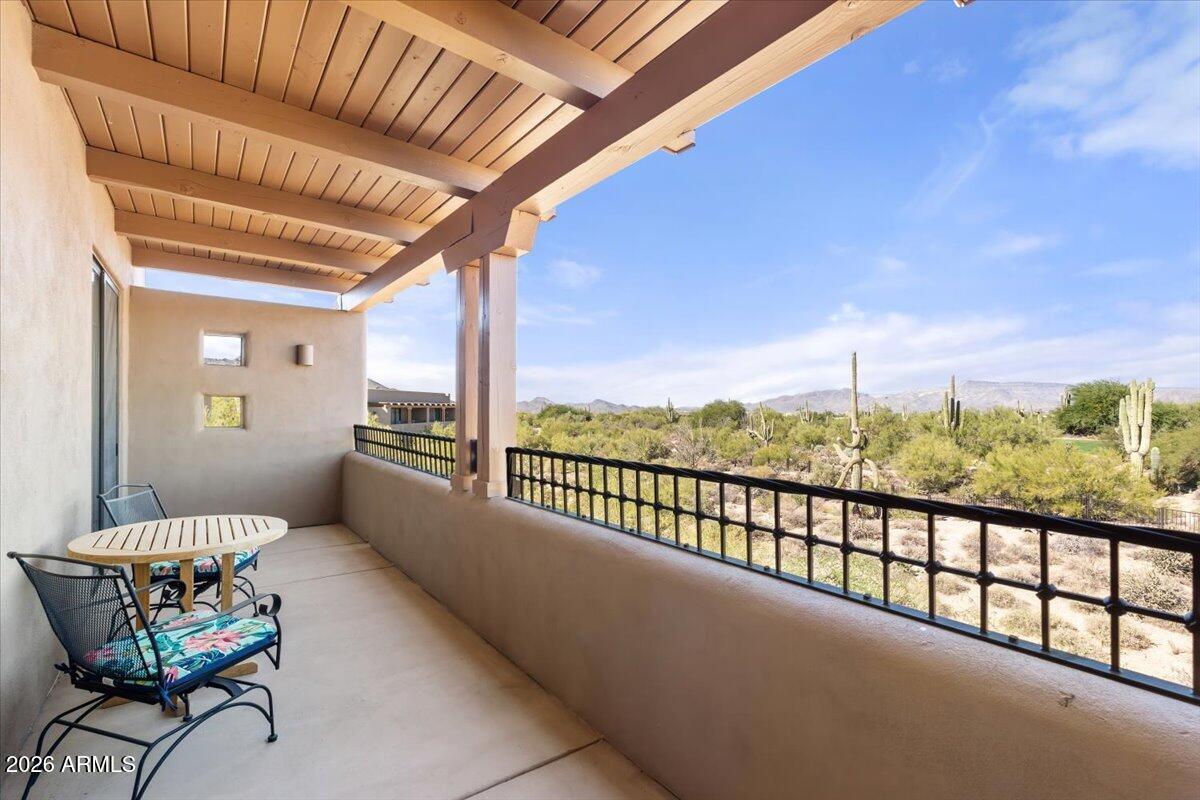 36601 North Mule Train Road, Unit C16 Carefree, AZ 85377 - Photo 13 of 38 a view of a chairs and table in the balcony