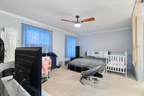 a bedroom with furniture and a window